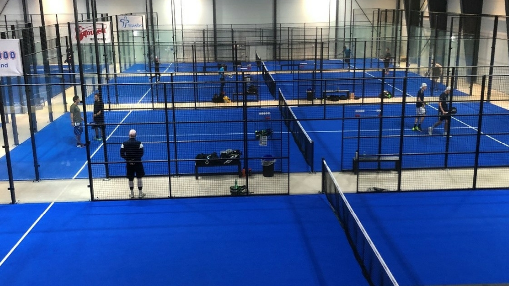 Indoor padel courts at Padel East in Frederikssund with players in action.