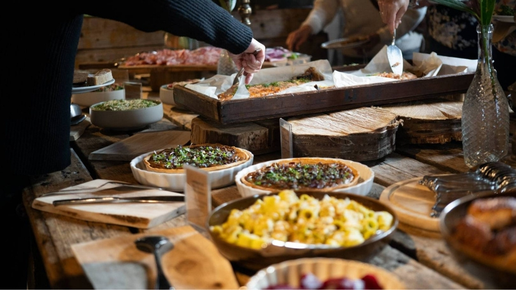Meeting catering at Sonnerupgaard Gods with buffet of quiches and salads in rustic surroundings.