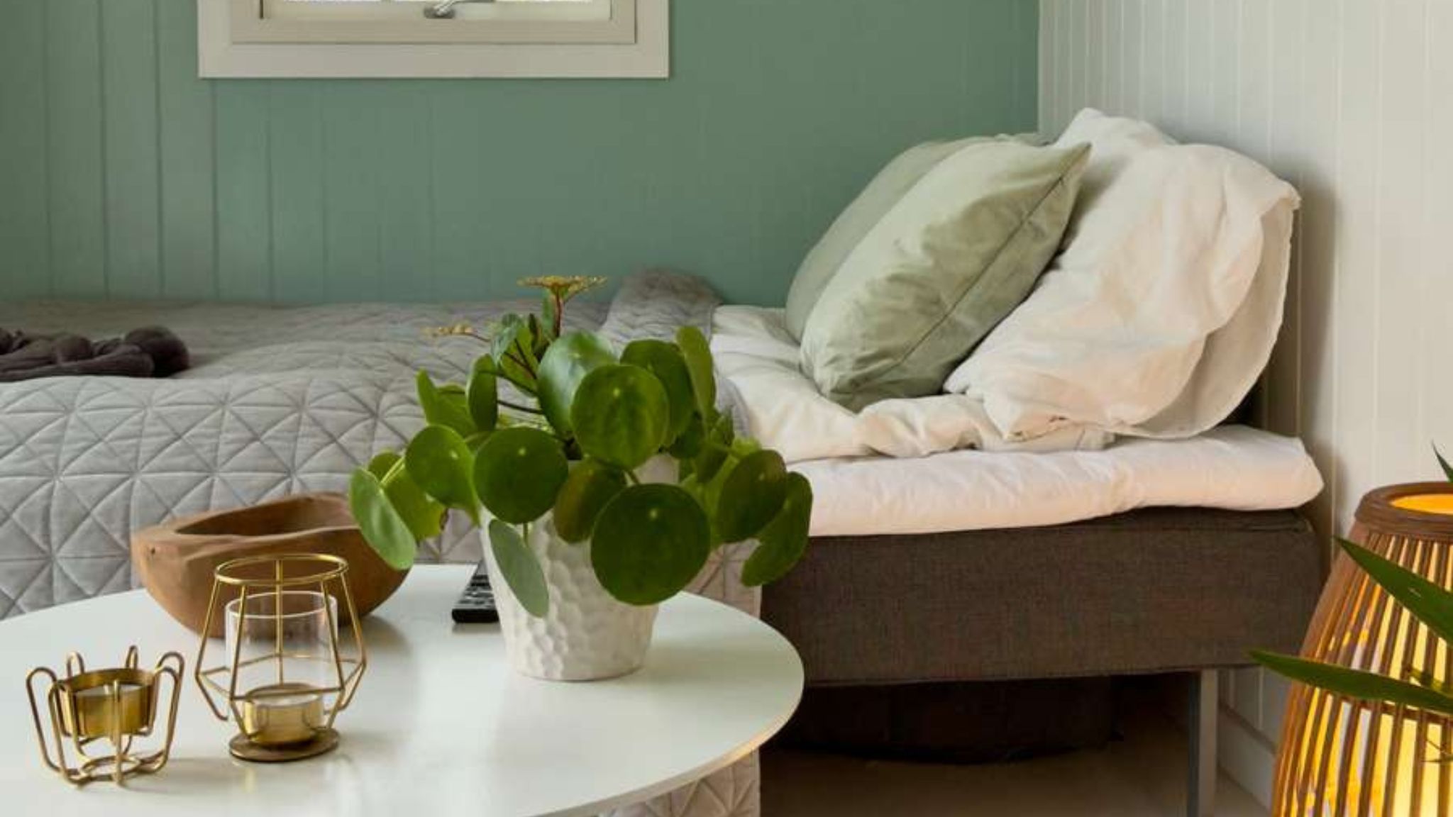 Interior of a Tiny House in Gl. Lejre with bed and cosy decor.