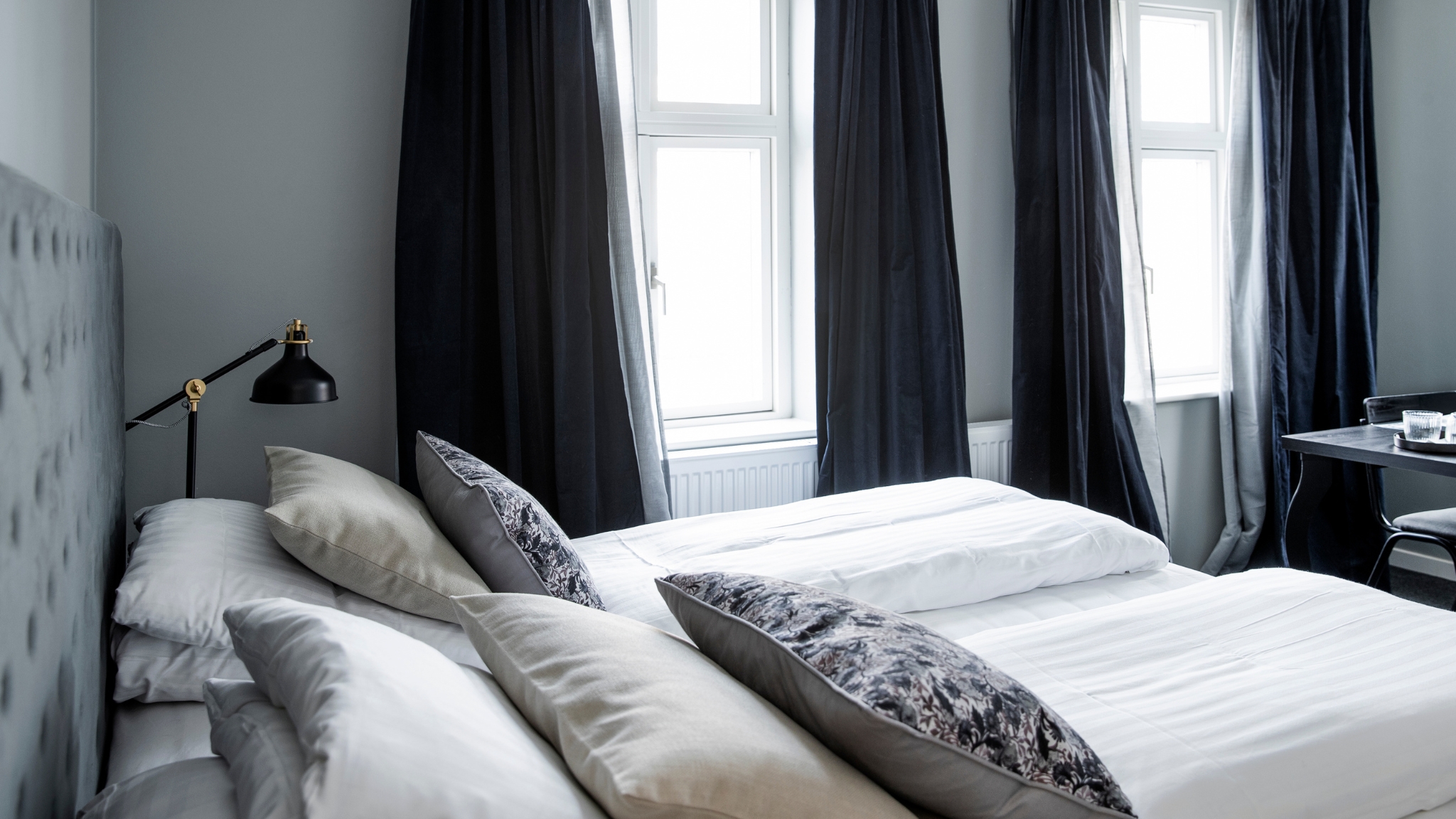 Modern hotel room with double bed at Skjalm Hvide Hotel.