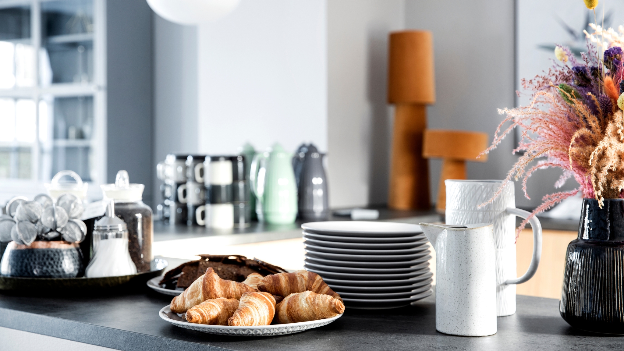 Serving area with croissants and coffee at Skjalm Hvide Hotel.