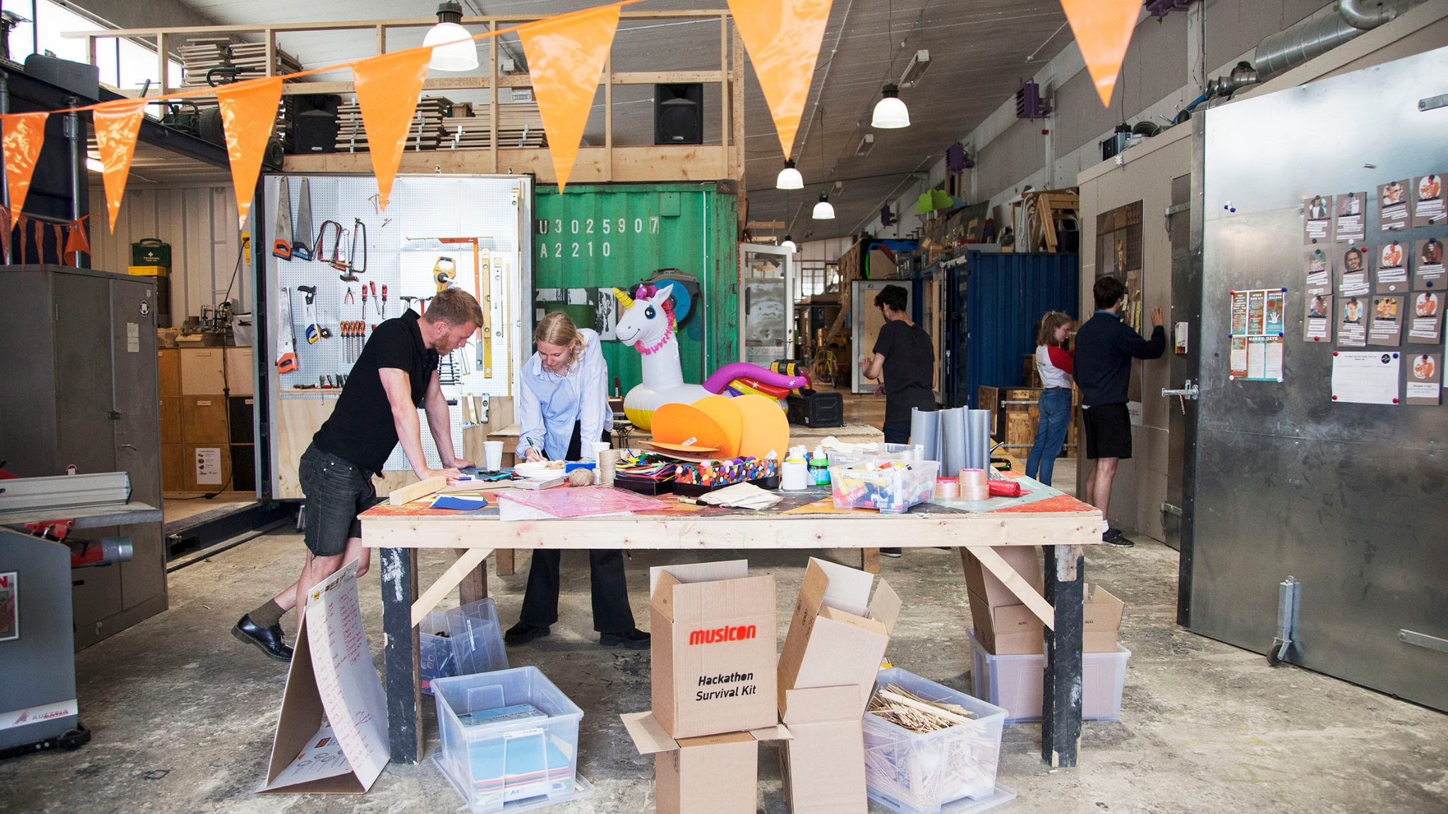 People working together at a table in a creative workshop at Musicon