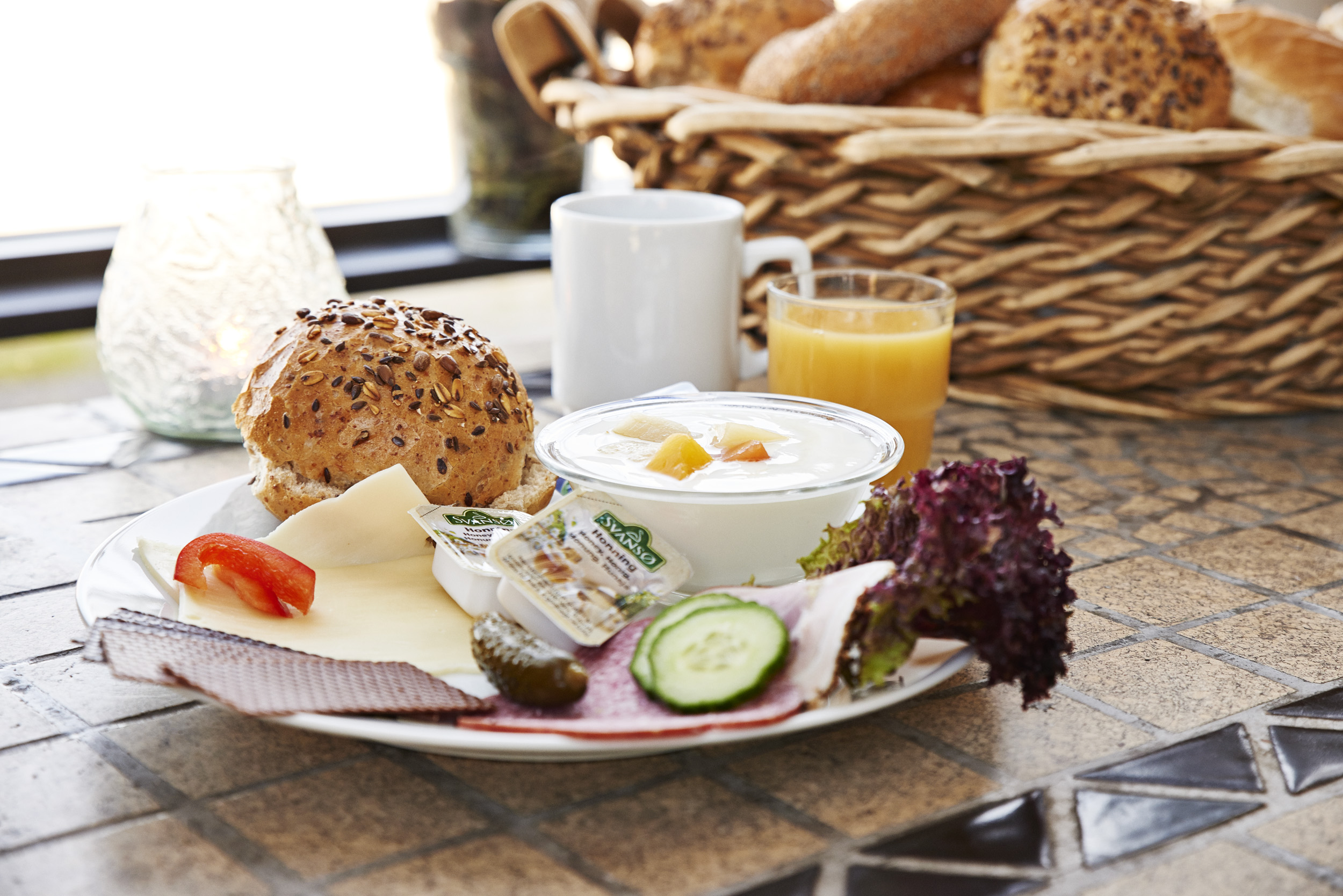 Breakfast with bread, juice and coffee at Danhostel Roskilde