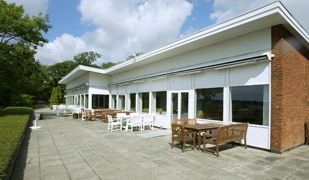 Tables and chairs on the terrace at Restaurant Kalvø
