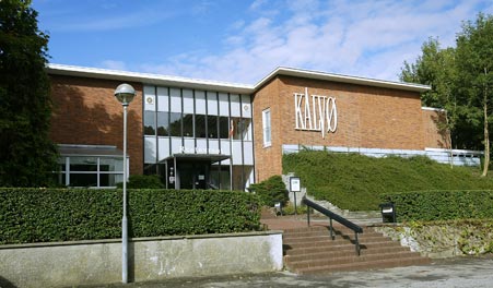 Restaurant Kalvø’s entrance with steps and facade sign