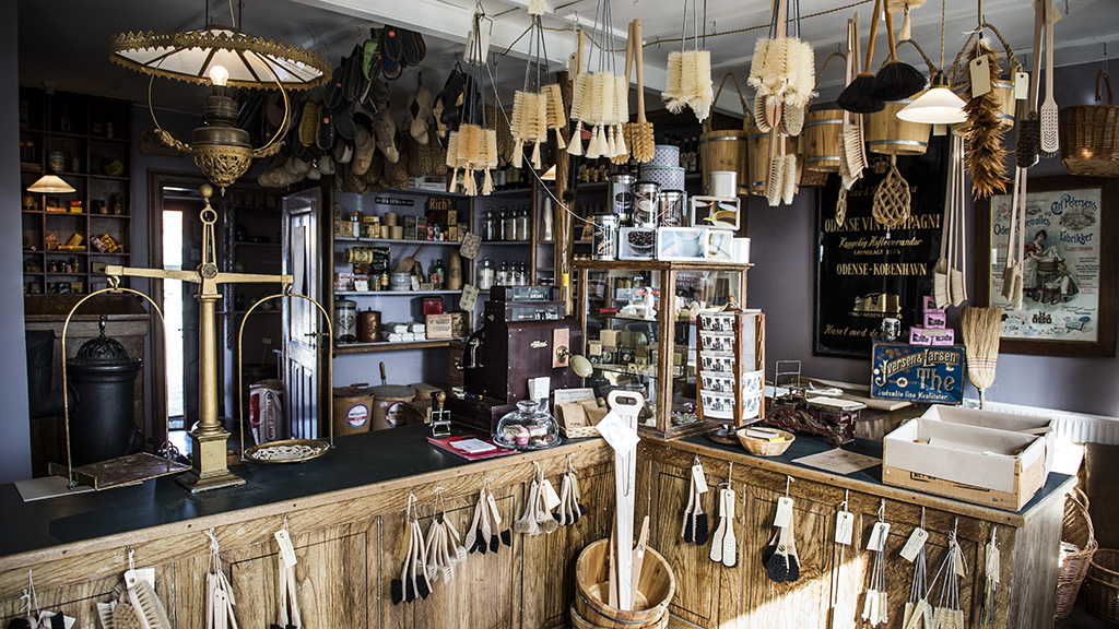 Old-fashioned grocer’s shop with historic goods, scales, and brushes at Lützhøft’s Old Grocer’s Shop, Roskilde.