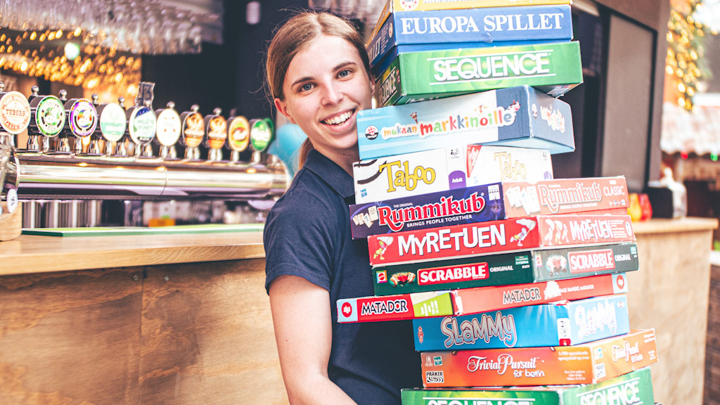 Plenty of board games can be found in the game cabinet behind SKUDEN