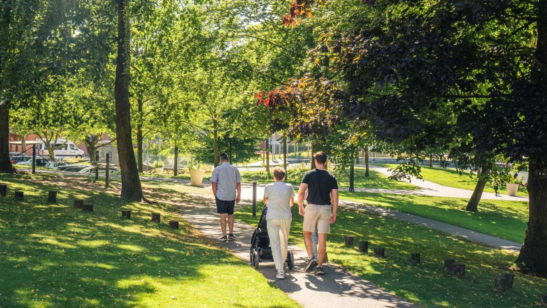 Family taking a walk in Mariaparken in Vejle on a summer day