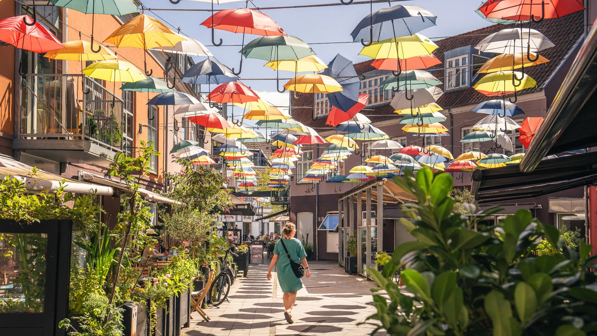 Woman walking in Midtpunktet in Vejle on a summer day