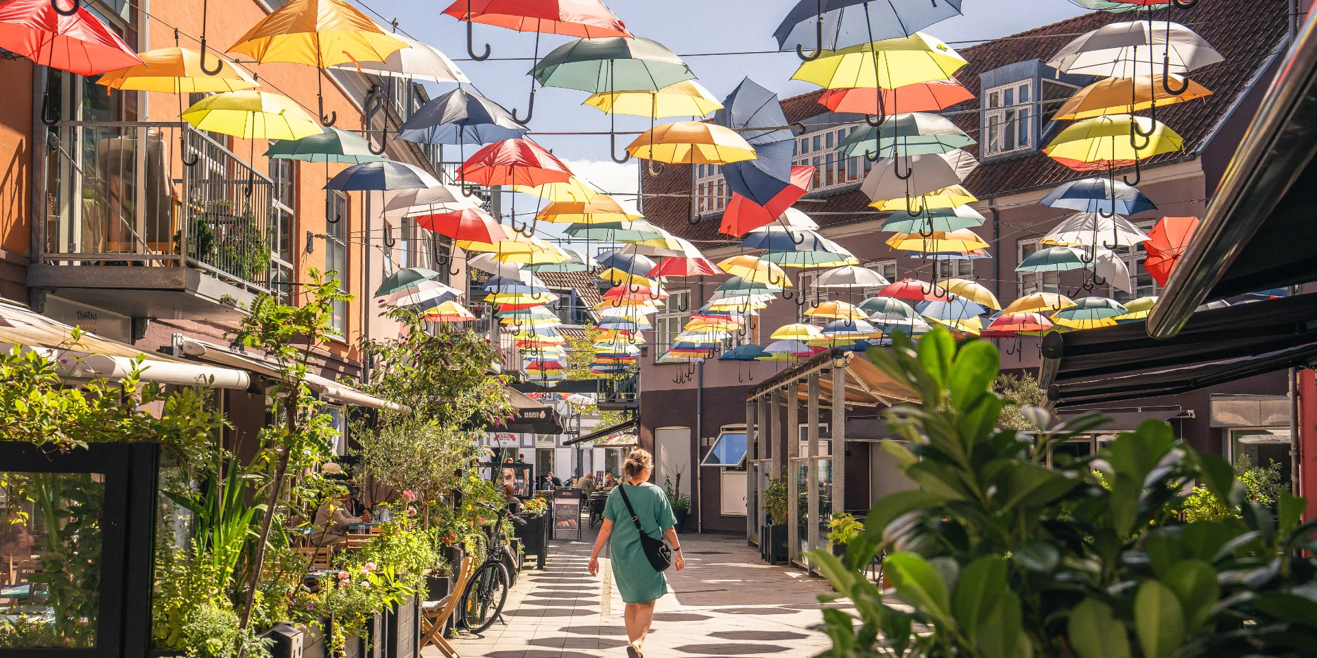 Woman walking in Midtpunktet in Vejle on a summer day