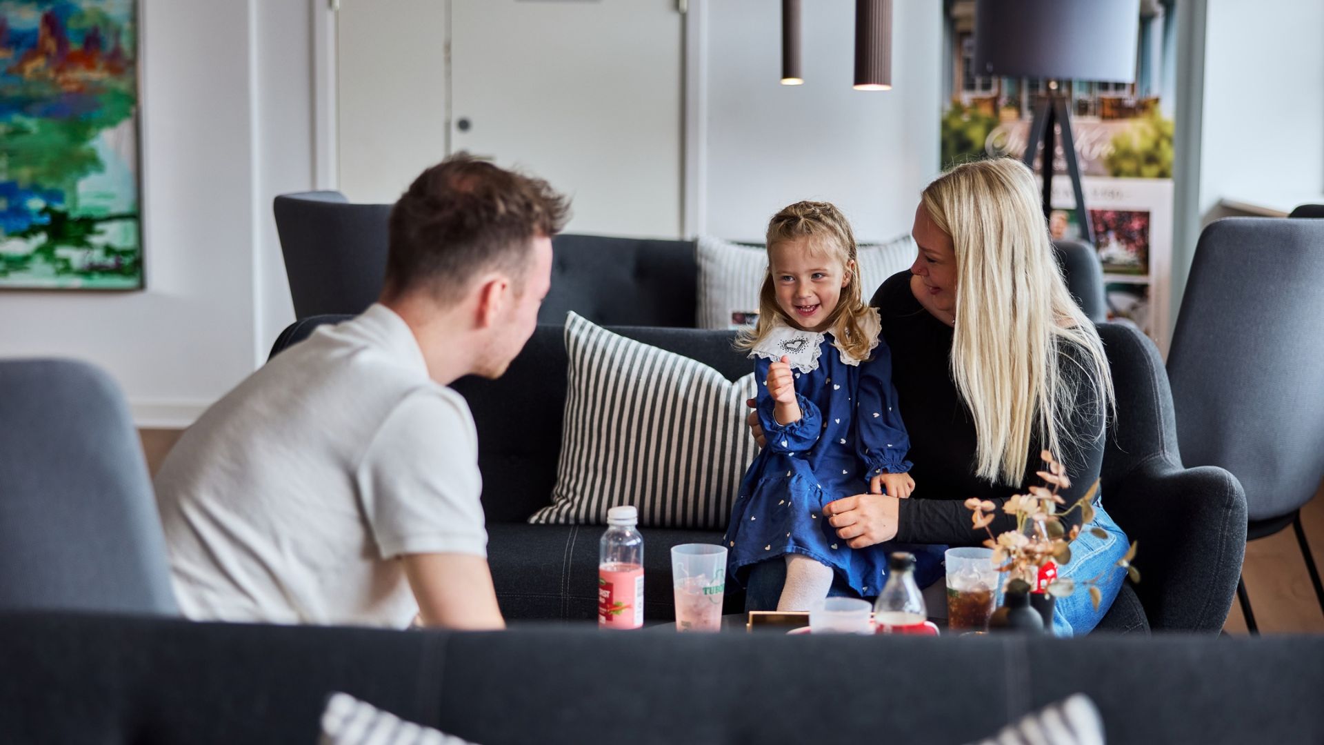 A family playing games together in the lounge at CABINN Vejle