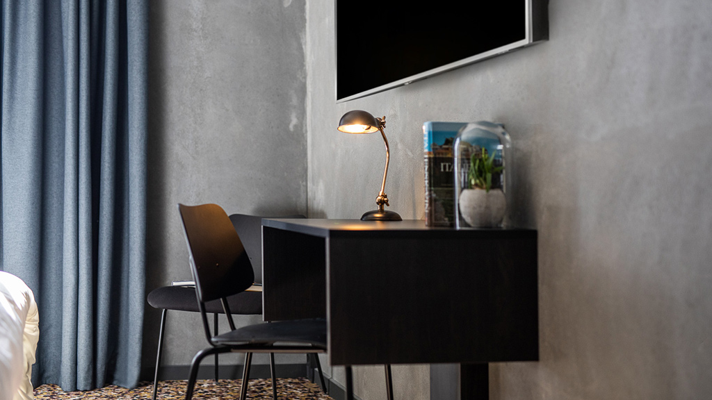 Desk and TV at Peak12 Hotel