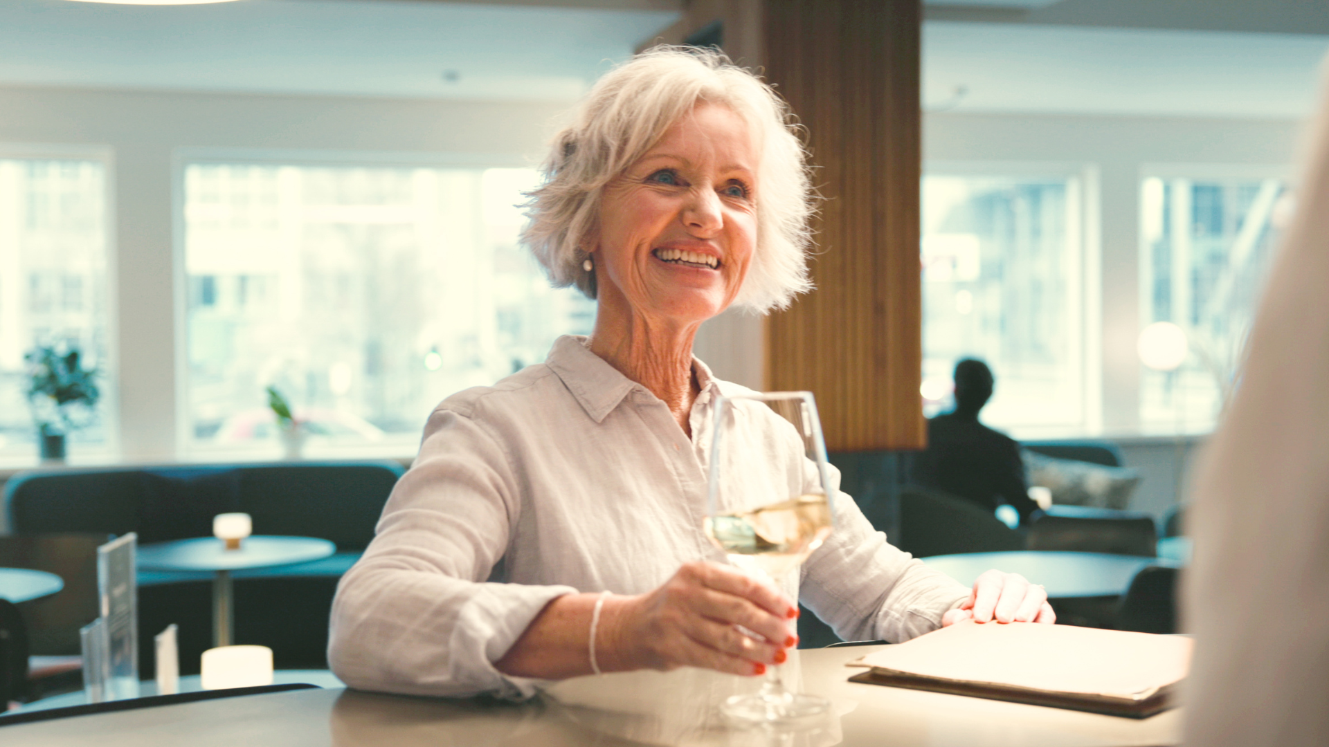 Smiling guest, lounge, wine