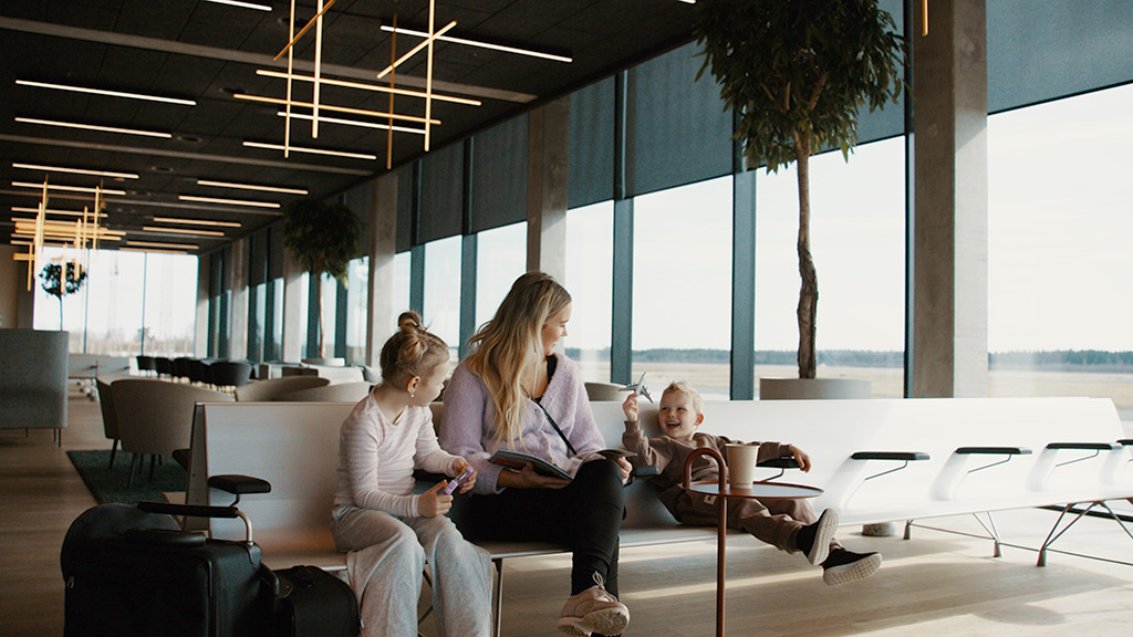 Family with children waiting at Aarhus Airport