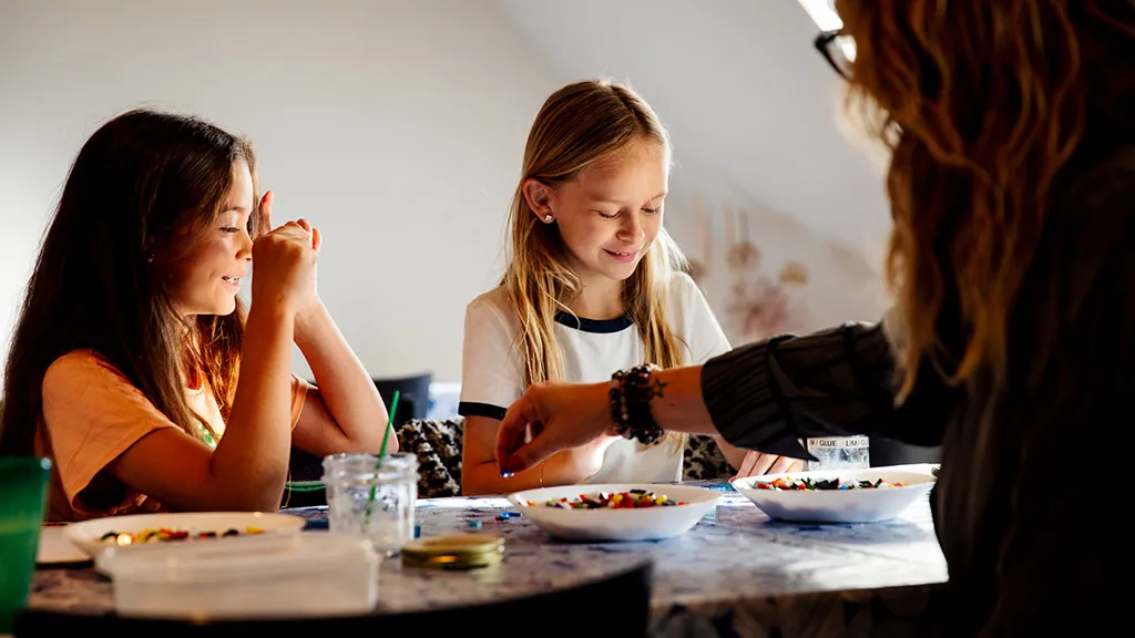Children play with glass beads at Glas - Museum of Glass Art