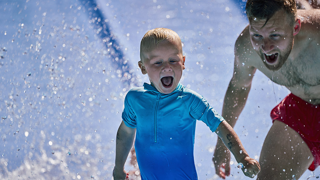 Father and son are having a great time at the water park in Djurs Sommerland