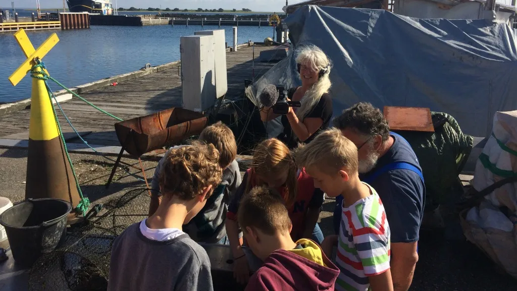 Children looking at fish outside The Old Shipyard.