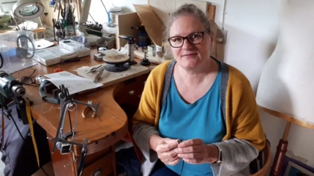 Jewelry designer Dorte Runge in her jewelry workshop.