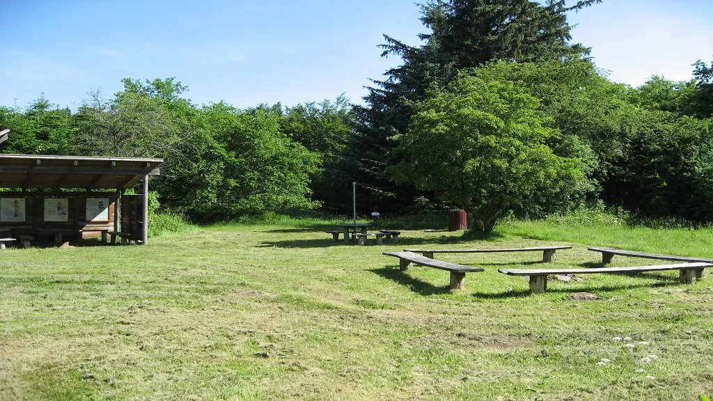 Playground with benches and a cabin