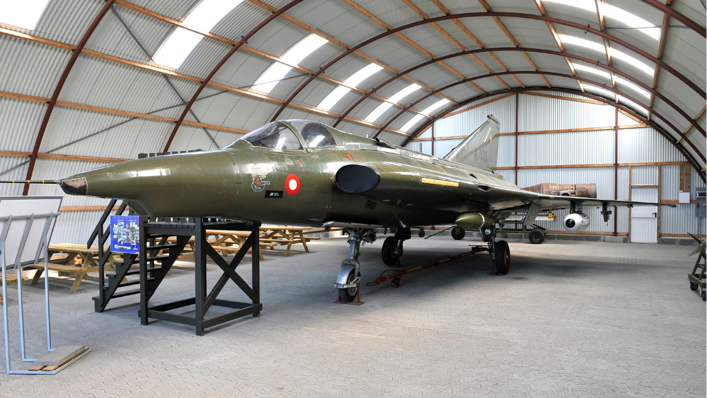 Open exhibition room with an old airplane.