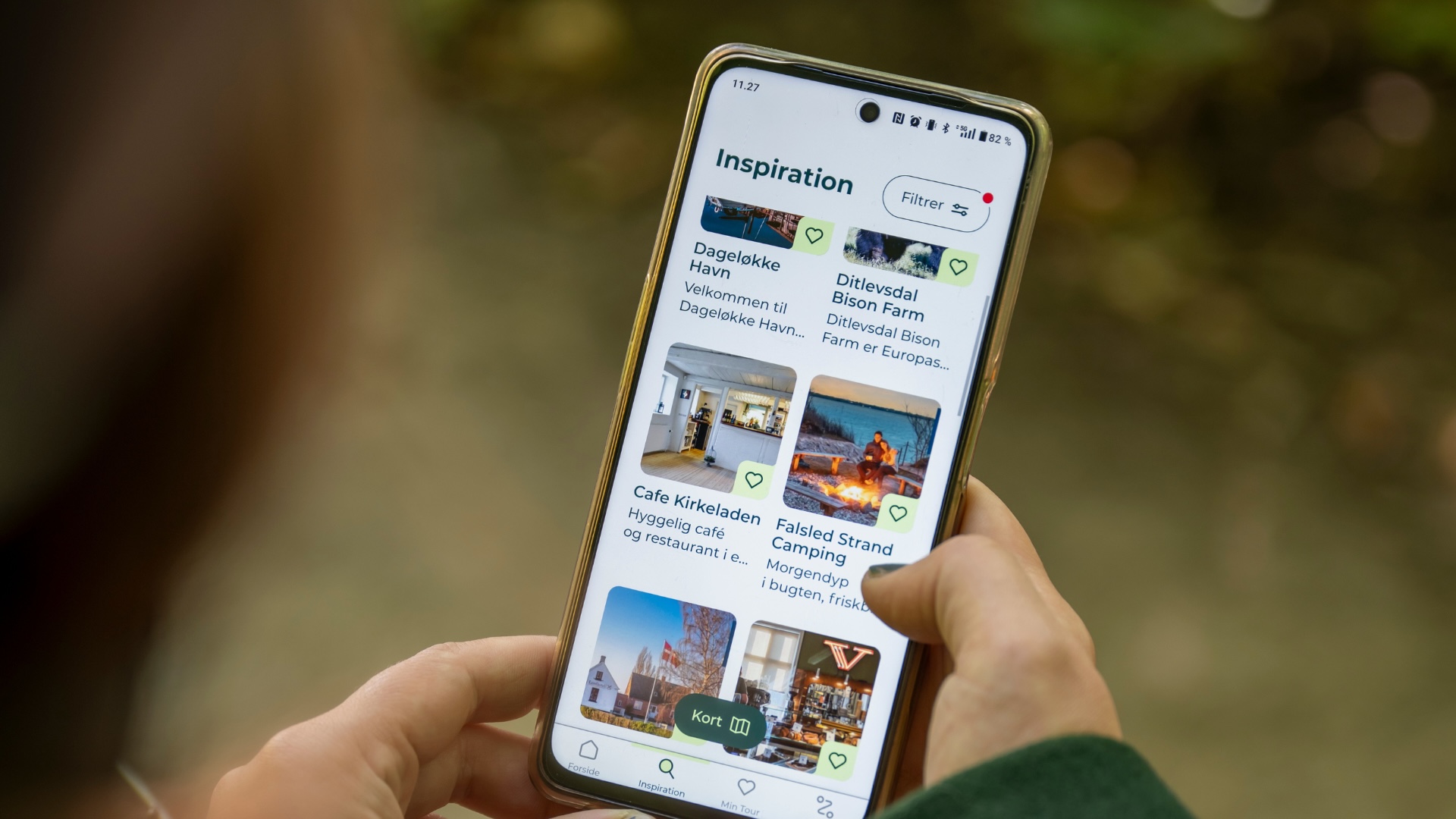 Nærbillede af VisitFynApp i hånd